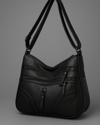 Bolso con múltiples compartimentos y textura suave®